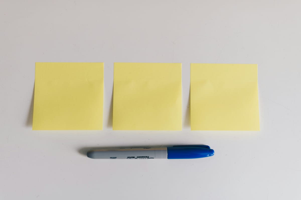 Three post-it notes and a Sharpie