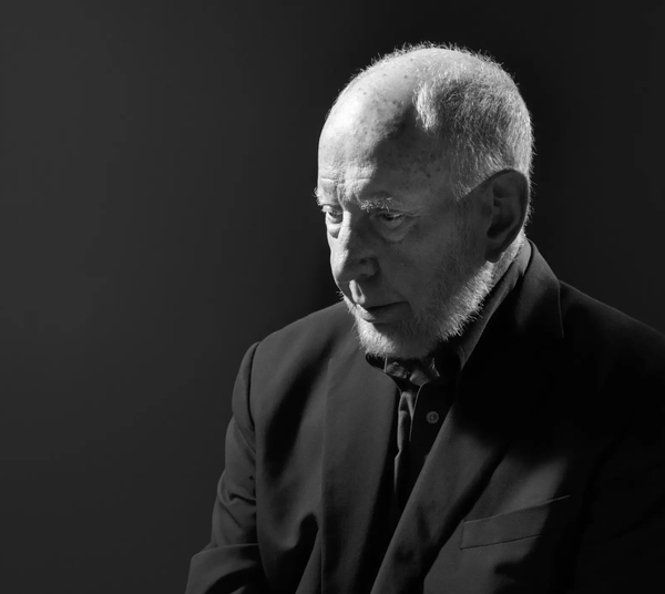 Black and white photo of Robert Putnam looking off-camera