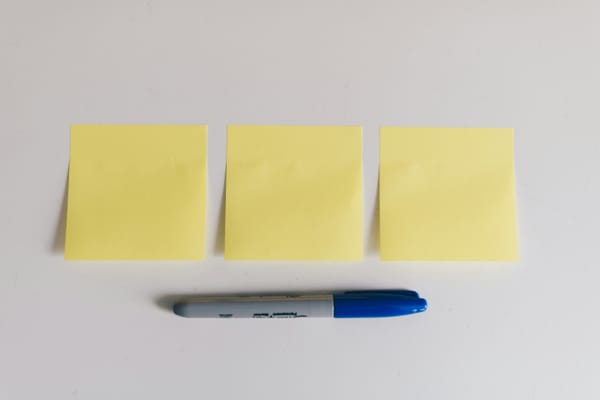 Three post-it notes and a Sharpie